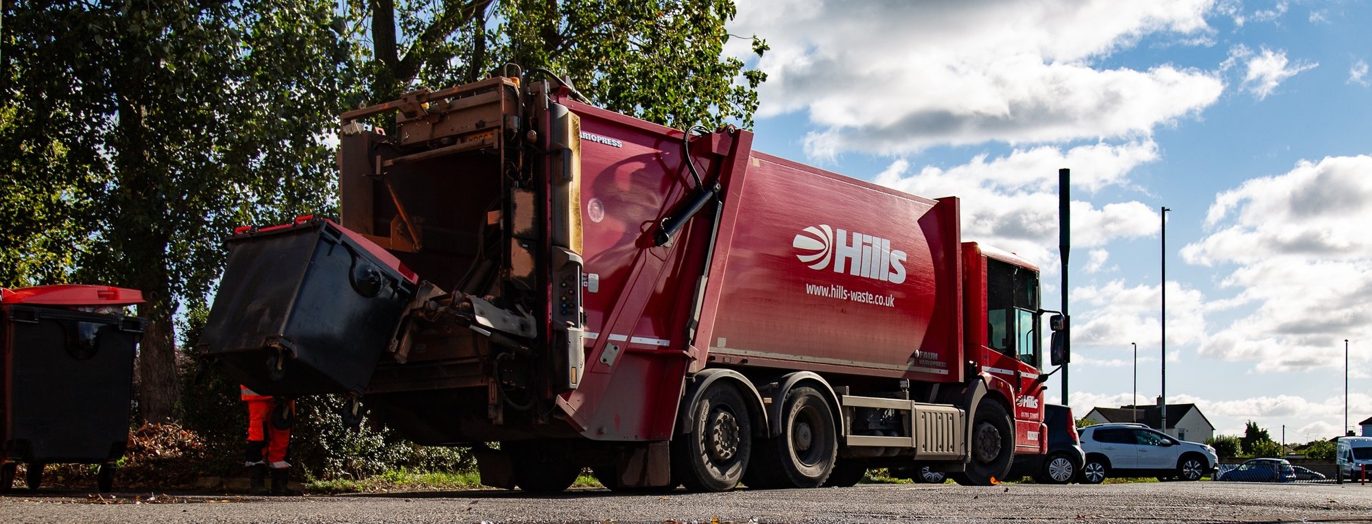 Hills Waste Red truck parked on a street